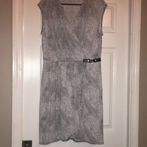 Printed dress with small leather detail.